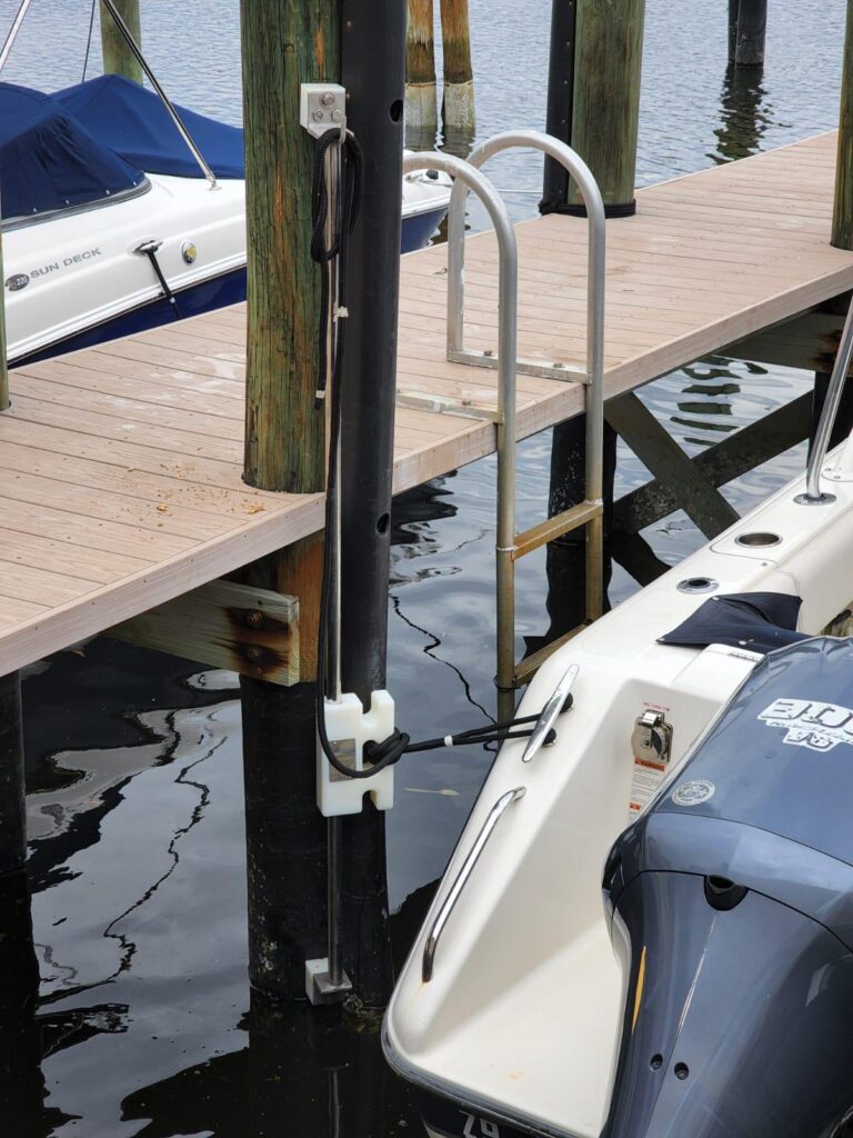 Boat tied to dock with tide slides