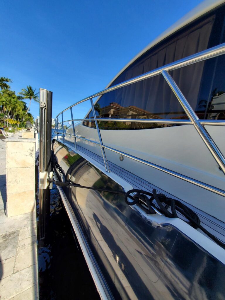 Boat tied to dock with tide slides